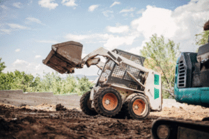 mini excavator vs skid steer
